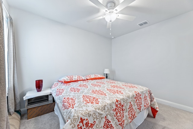 bedroom with ceiling fan and light colored carpet