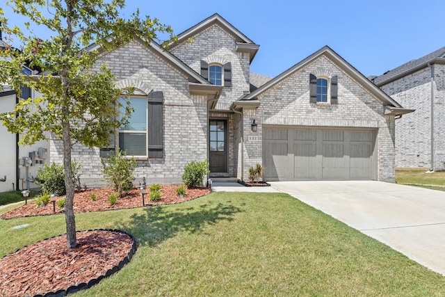 french provincial home with a garage and a front yard