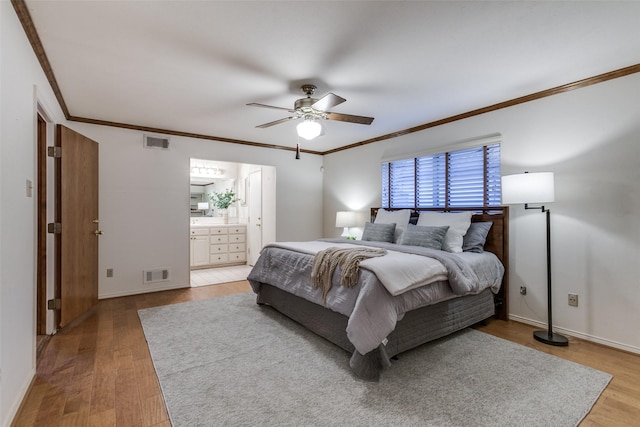 bedroom with hardwood / wood-style flooring, ensuite bath, ceiling fan, and crown molding