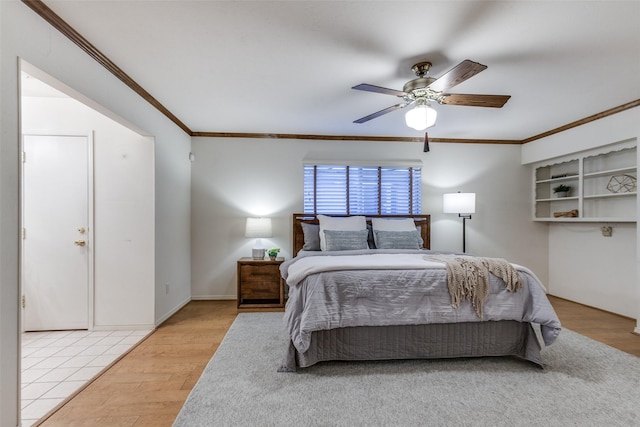 bedroom with light wood-type flooring, ceiling fan, and ornamental molding