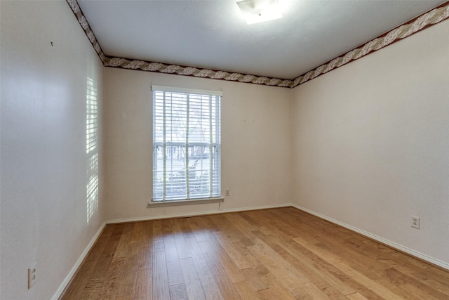 spare room featuring light wood-type flooring