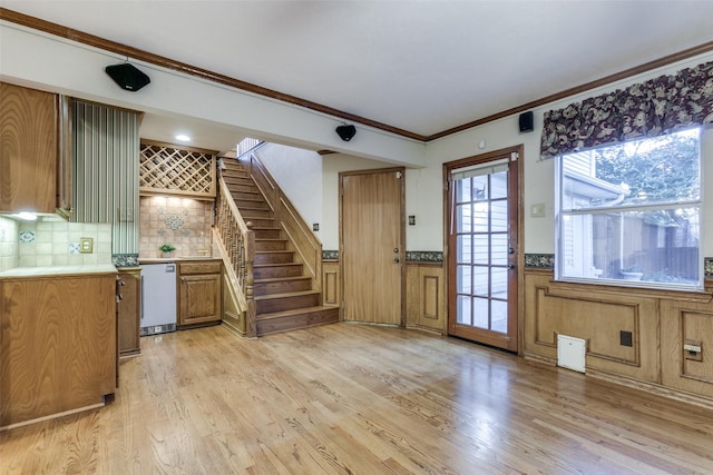 interior space featuring light hardwood / wood-style floors and crown molding