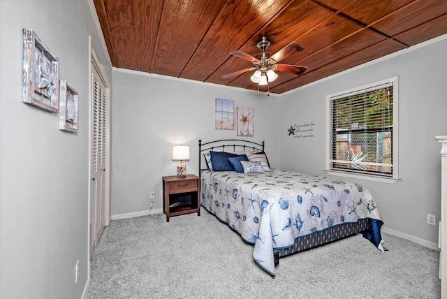 326 Glomin Ln, Pottsboro, TX 75076 - bedroom with crown molding, carpet, wood ceiling, a closet, and baseboards