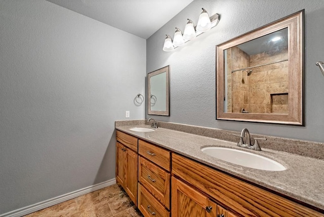 326 Glomin Ln, Pottsboro, TX 75076 - bathroom featuring double vanity, baseboards, and a tile shower