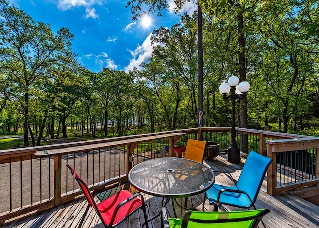 326 Glomin Ln, Pottsboro, TX 75076 - wooden deck featuring outdoor dining space and view of scattered trees
