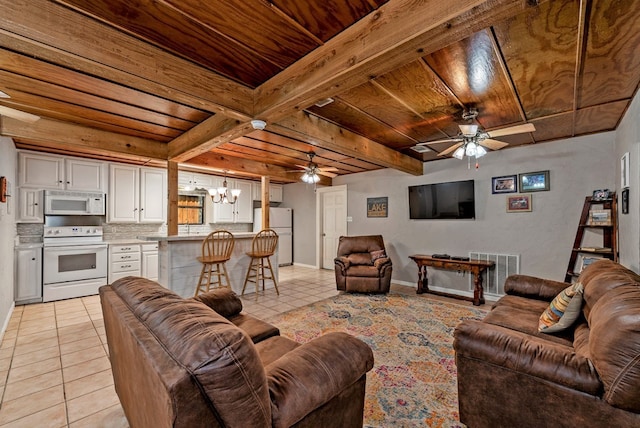 tiled living room featuring beamed ceiling, ceiling fan with notable chandelier, and wooden ceiling