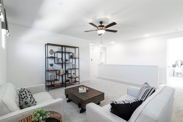 living room featuring ceiling fan and light carpet