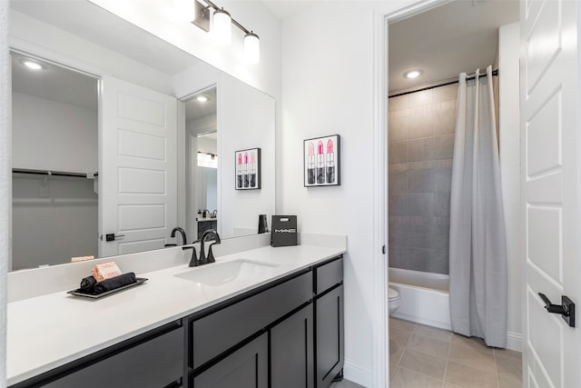 full bathroom with tile patterned flooring, vanity, shower / bath combo, and toilet