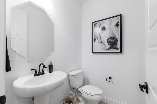 bathroom with toilet and sink