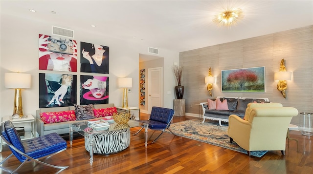 living room with recessed lighting, wood finished floors, visible vents, and baseboards