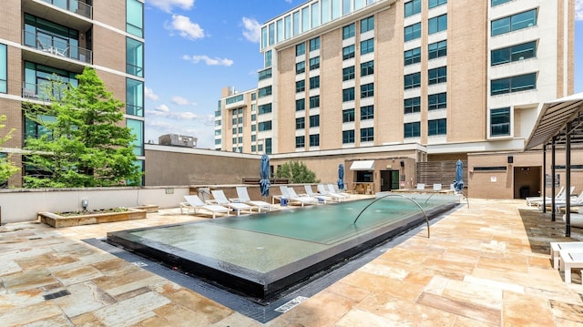 view of swimming pool featuring a patio