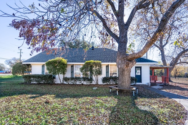 ranch-style house with a front lawn