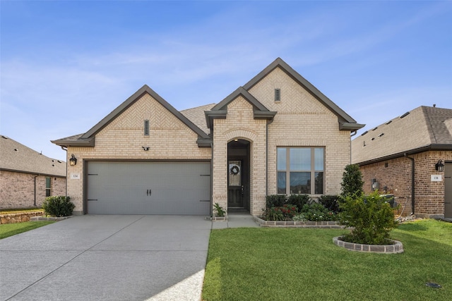 french country inspired facade with a garage and a front lawn