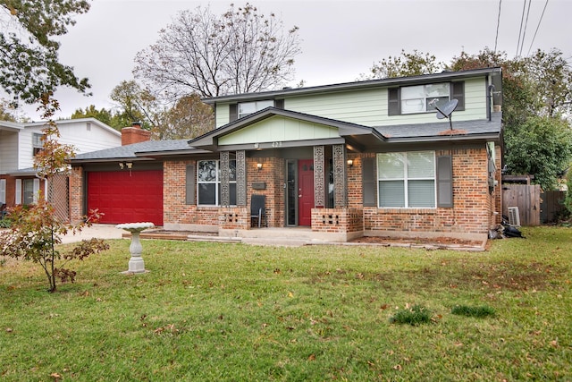 view of front of home featuring a garage and a front lawn