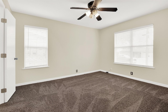 carpeted spare room with ceiling fan