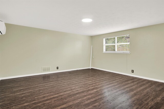 empty room featuring dark wood-type flooring