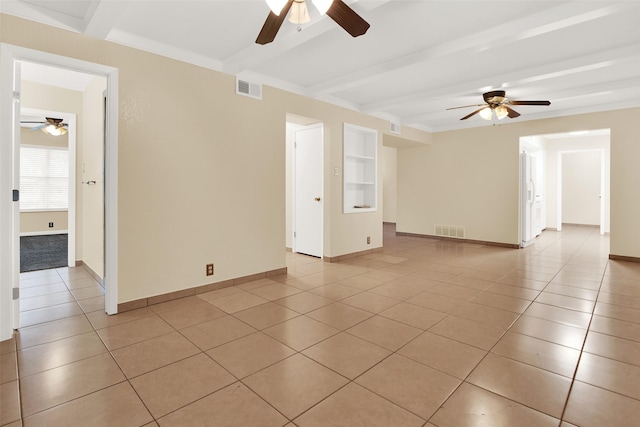 tiled empty room with beam ceiling and ceiling fan