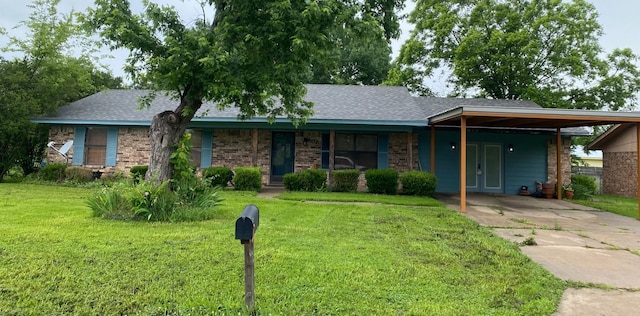 ranch-style house with a carport and a front yard