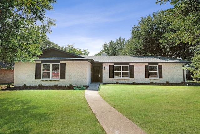 single story home with a front yard