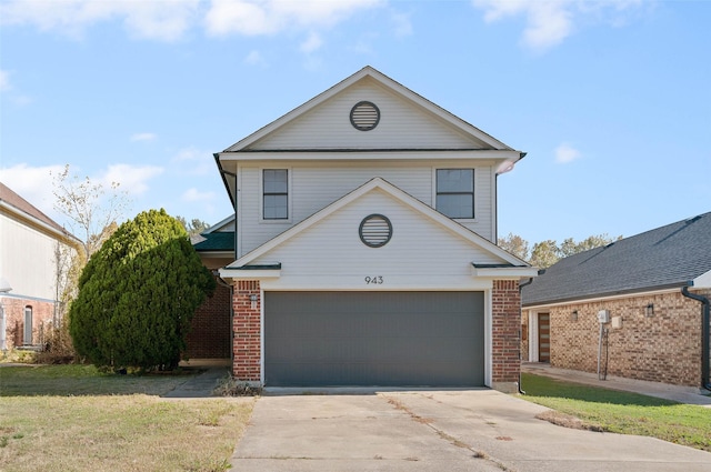 front facade featuring a front yard and a garage