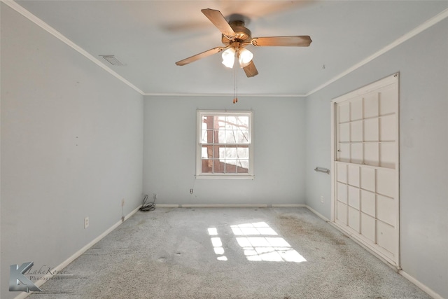 unfurnished room featuring crown molding, light carpet, and ceiling fan