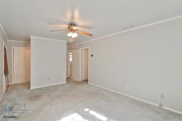 interior space with crown molding, ceiling fan, and light carpet