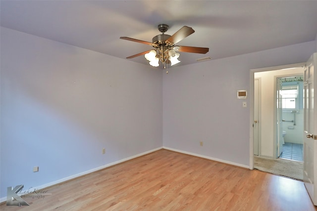 spare room with ceiling fan and light hardwood / wood-style flooring