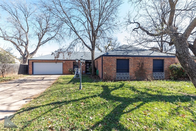 ranch-style house featuring a garage and a front lawn