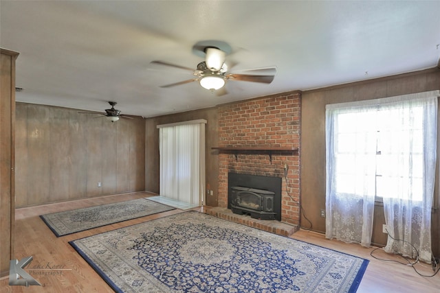 living room featuring ceiling fan and light hardwood / wood-style floors