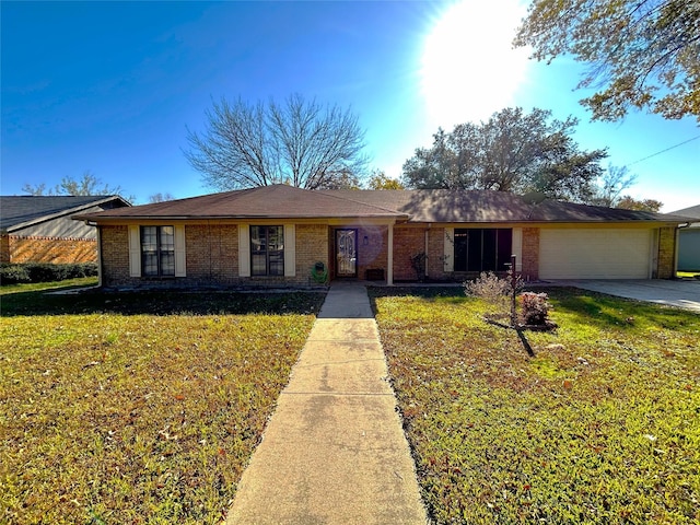 single story home with a garage and a front yard