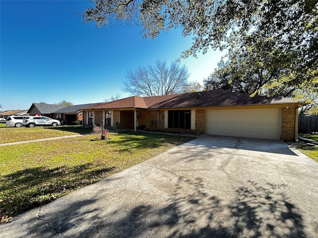 ranch-style house with a front yard and a garage