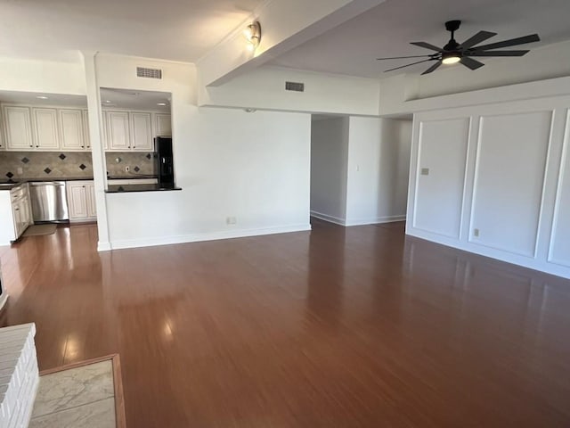 unfurnished living room featuring ceiling fan and hardwood / wood-style floors