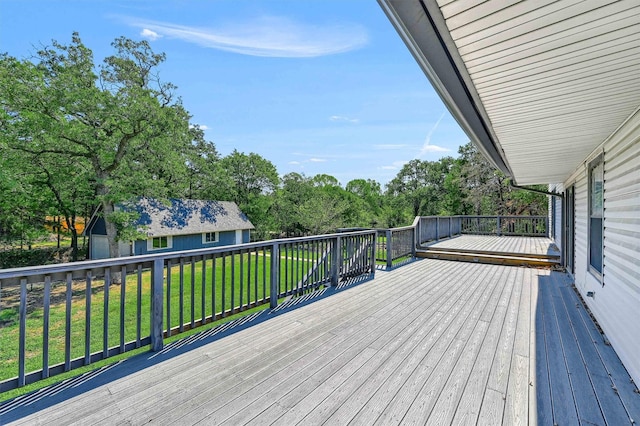 wooden terrace with a yard