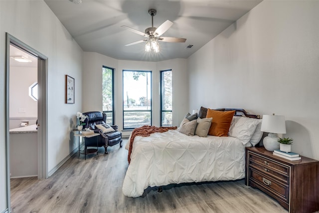 bedroom with light hardwood / wood-style flooring and ceiling fan