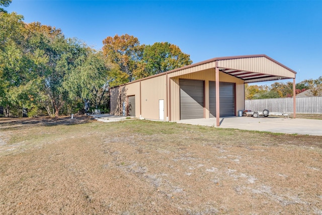 garage featuring a lawn