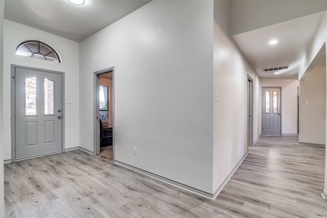 entryway with light hardwood / wood-style floors