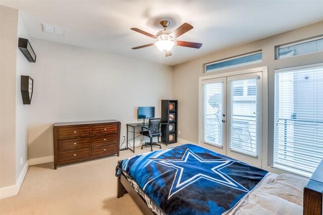 carpeted bedroom featuring french doors, access to outside, and ceiling fan