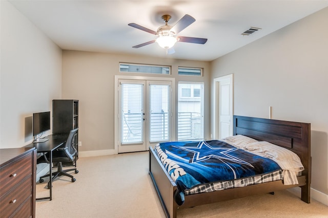 carpeted bedroom featuring access to exterior and ceiling fan