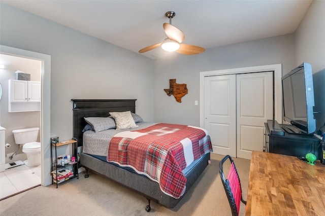 carpeted bedroom with ceiling fan, connected bathroom, and a closet