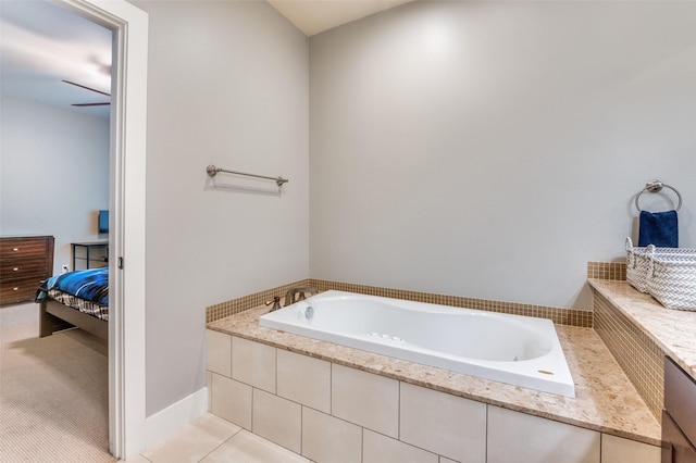 bathroom with tile patterned floors and tiled tub