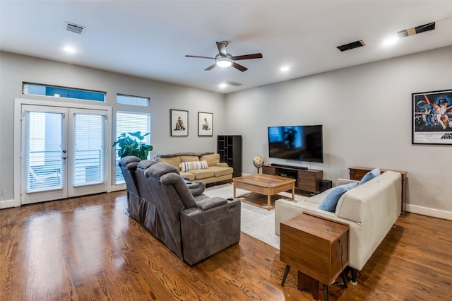 living room with ceiling fan, dark hardwood / wood-style flooring, and french doors