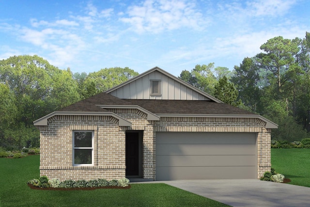 view of front of property featuring a garage and a front yard