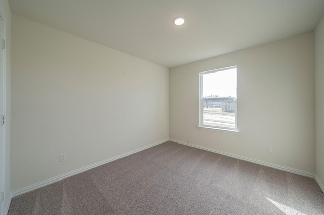 unfurnished room with carpet floors