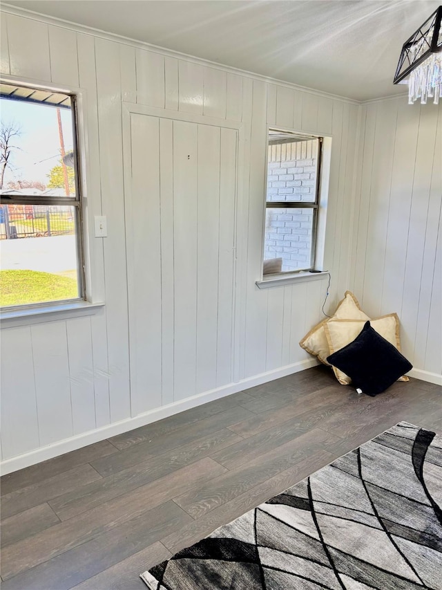 unfurnished bedroom with ornamental molding and dark hardwood / wood-style floors