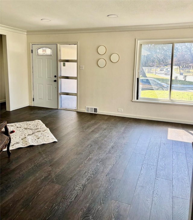 foyer with crown molding and dark hardwood / wood-style flooring