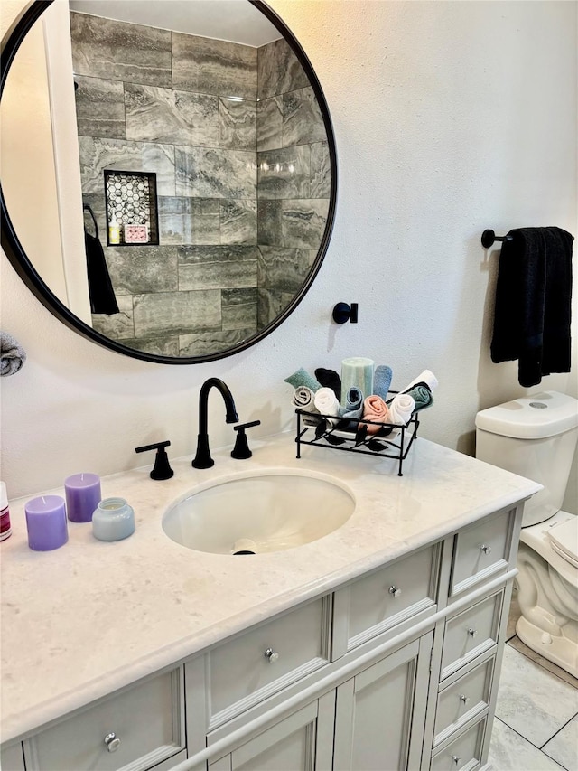 bathroom with toilet and vanity