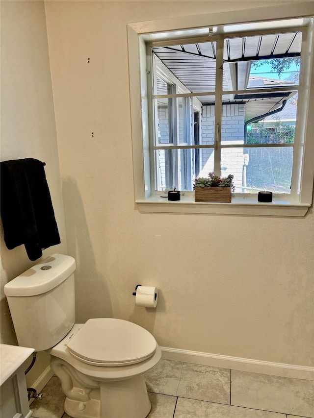 bathroom featuring toilet and tile patterned floors