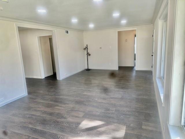 unfurnished room featuring crown molding and dark hardwood / wood-style flooring