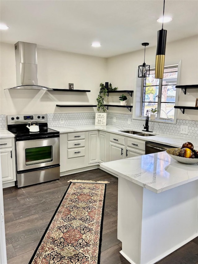 kitchen featuring stainless steel appliances, light stone countertops, range hood, sink, and white cabinetry