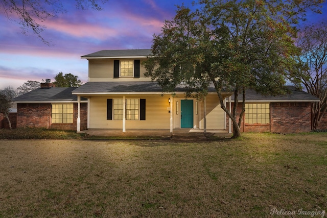 view of front of home with a yard